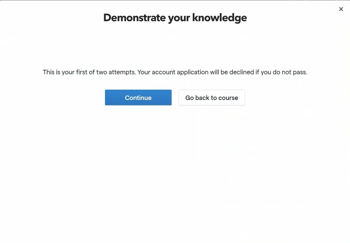 A modal headed 'Demonstrate your knowledge' containing the text 'This is your first of two attempts. Your account application will be declined if you do not pass.', a Continue button and a 'Go back to course' button.