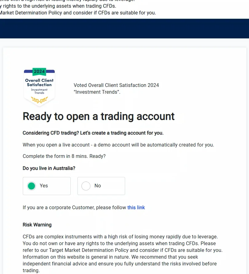 OANDA account opening screen with Australia selected, a satisfaction badge, and a risk warning paragraph below the form prompt.